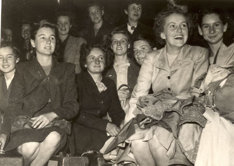 03, Beckenham County School for Girls on 1946 school trip to Sweden wait to be picked up at the station in Stockholm.jpg